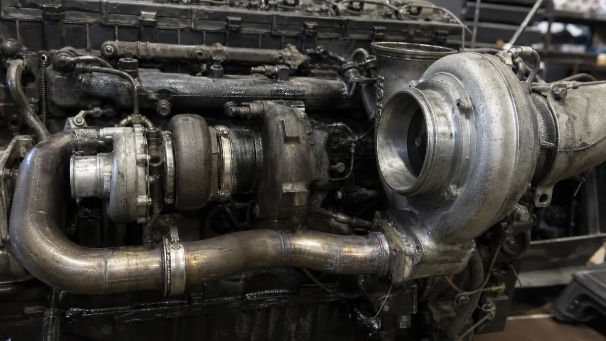 Twin-turbo setup on a Cat C15 ACERT engine with the small high-pressure and large low-pressure turbochargers
